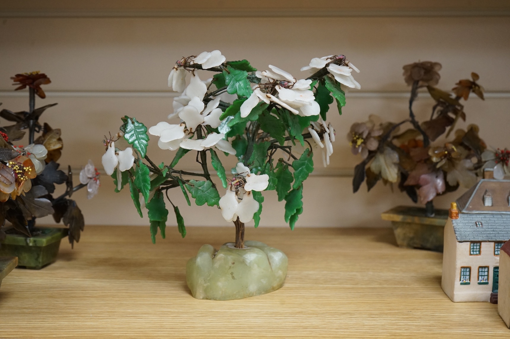 A collection of four ornamental Chinese hardstone flowering trees, tallest 22cm.
